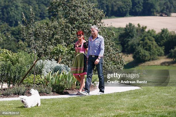 Andrea Berg and her husband Uli Ferber walk prior to the Andrea Berg Open Air festival 'Heimspiel' on July 19, 2014 in Grossaspach, Germany.