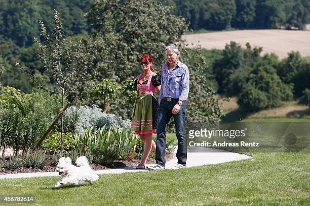 Andrea Berg and her husband Uli Ferber walk prior to the Andrea Berg Open Air festival 'Heimspiel' on July 19, 2014 in Grossaspach, Germany.