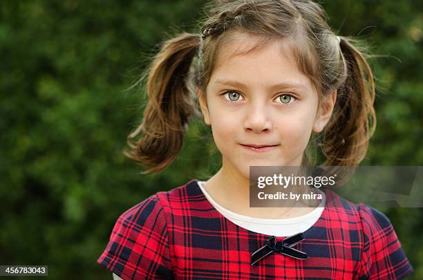 beautiful smiling girl, hair into pigtails - groene ogen stockfoto's en -beelden