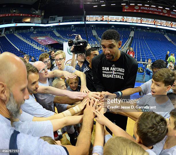 Tim Duncan of the San Antonio Spurs huddles up during an NBA Cares Special Olympics Clinic as part of the 2014 Global Games on October 7, 2014 at the...