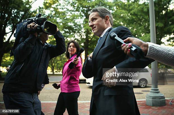 Former U.S. Secretary of the Treasury Timothy Geithner is surrounded by members of the media as he arrives at U.S. Court of Federal Claims to testify...