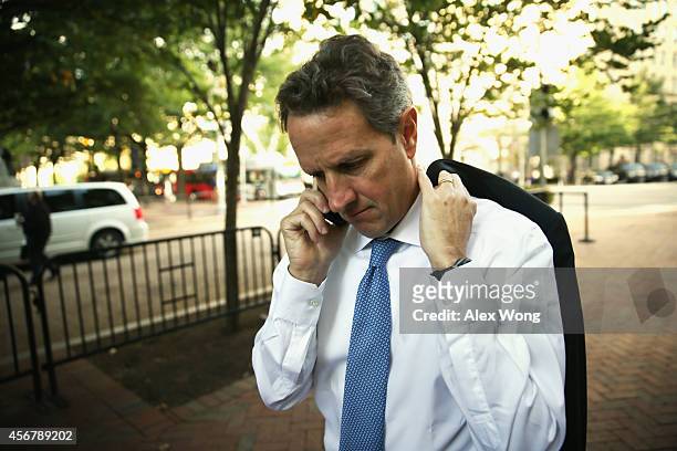 Former U.S. Secretary of the Treasury Timothy Geithner arrives at U.S. Court of Federal Claims to testify at the AIG trial October 7, 2014 in...