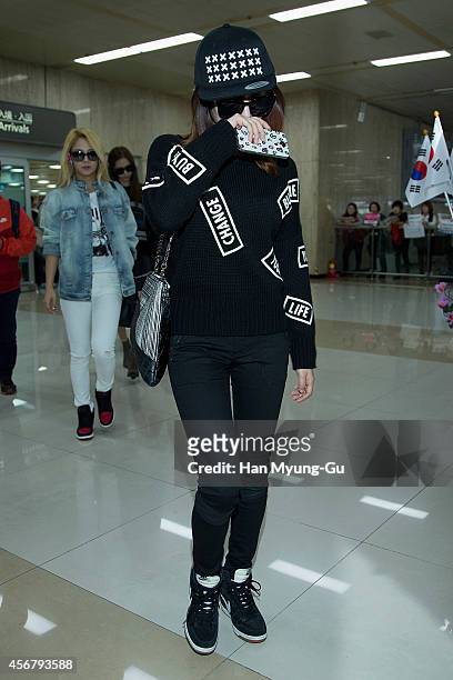 Sunny of South Korean girl group Girls' Generation is seen upon arrival at Gimpo International Airport on October 7, 2014 in Seoul, South Korea.