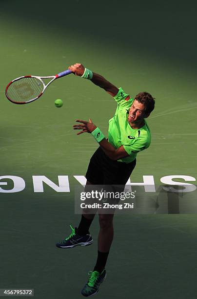 Vasek Pospisil of Canada serves during his match against Santiago Giraldo of Columbia during the day 3 of the Shanghai Rolex Masters at the Qi Zhong...