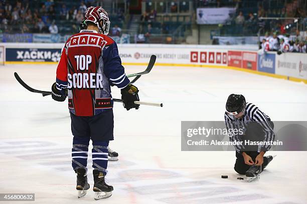 Top Scorer Brandon Buck of Ingolstadt and Robbie Earl of Zug wait for the Bully whilst referee Markku Buse adjusts his skates during the Champions...