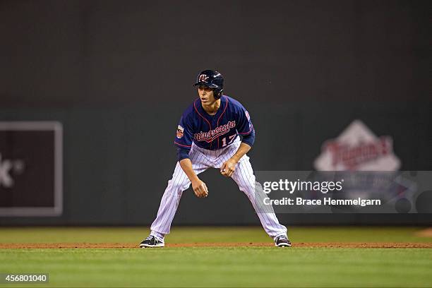 Doug Bernier of the Minnesota Twins runs against the Detroit Tigers on September 16, 2014 at Target Field in Minneapolis, Minnesota. The Twins...