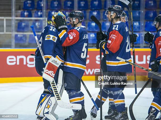 Jesse Virtanen congratulates Oskari SetÃ¤nen for the shutout during the Champions Hockey League group stage game between Lukko Rauma and Lulea Hockey...