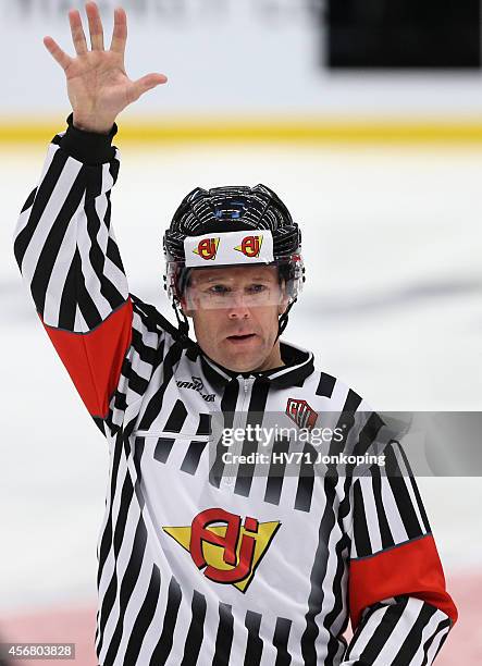 Referee Wolmer Edqvist during the Champions Hockey League group stage game between HV71 Jonkoping and JYP Jyvaskyla on October 7, 2014 in Jonkoping,...