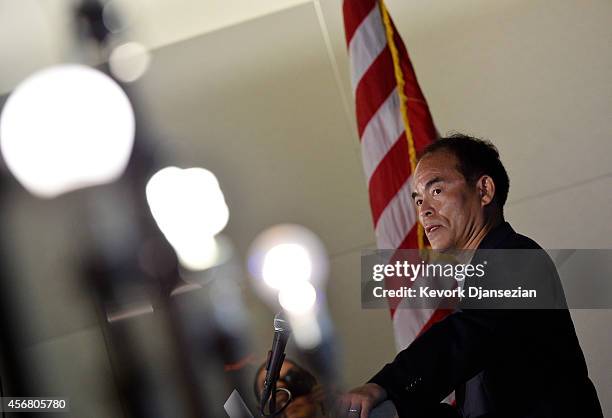 Santa Barbara scientist Shuji Nakamura speaks during a news conference with LED lights on display after sharing a Nobel Prize for physics for...