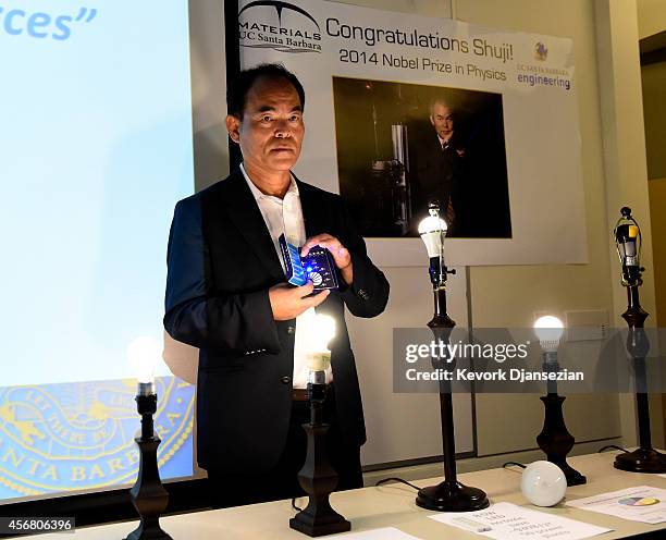 Santa Barbara scientist Shuji Nakamura demonstrates a blue LED light after sharing a Nobel Prize for physics for invention of blue LED light October...