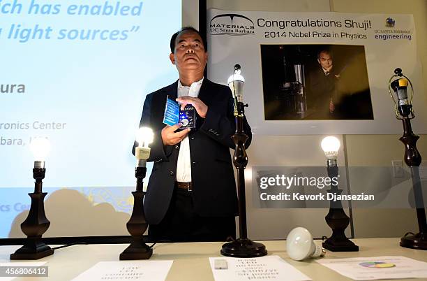Santa Barbara scientist Shuji Nakamura demonstrates a blue LED light after sharing a Nobel Prize for physics for invention of blue LED light October...