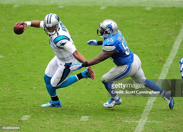 Cam Newton of the Carolina Panthers is pursued by Stephen Tulloch of the Detroit Lions at Bank of America Stadium on September 14, 2014 in Charlotte,...