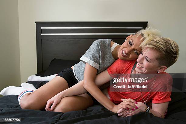 Soccer players Joanna Lohman and Lianne Sanderson are photographed for People Magazine on April 30, 2014 in Boston, Massachusetts.