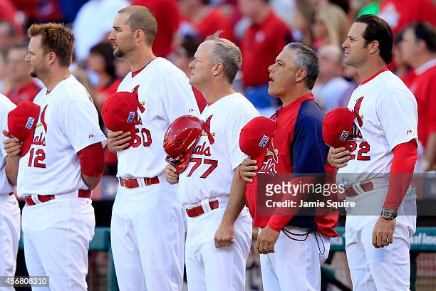 The St. Louis Cardinals line up for the National Anthem prior to Game Four of the National League Divison Series against the Los Angeles Dodgers at...
