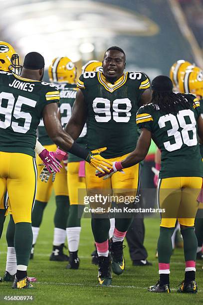 Letroy Guion of the Green Bay Packers takes the field during player introductions before the NFL game against the Minnesota Vikings on October 02,...