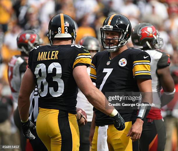 Quarterback Ben Roethlisberger of the Pittsburgh Steelers talks to tight end Heath Miller during a game against the Tampa Bay Buccaneers at Heinz...