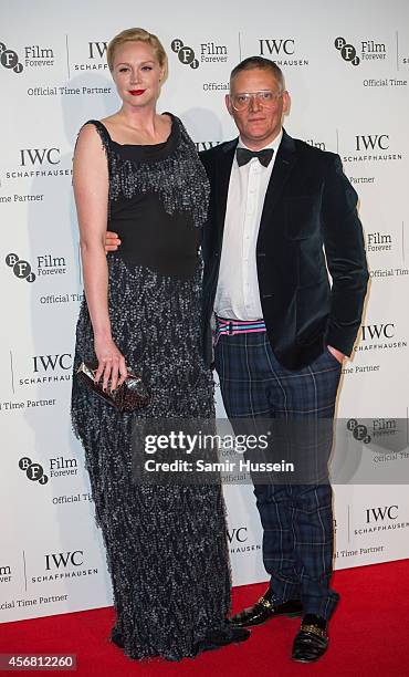 Gwendoline Christie and Giles Deacon attend the IWC Gala dinner in honour of the BFI at Battersea Evolution on October 7, 2014 in London, England.