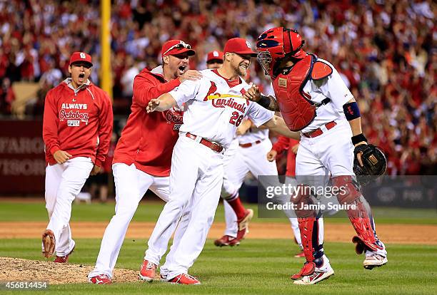 Trevor Rosenthal of the St. Louis Cardinals celebrates with teammates after defeating the Los Angeles Dodgers in Game Four of the National League...