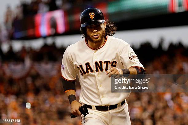 Brandon Crawford of the San Francisco Giants scores after Gregor Blanco was walked in the second inning against the Washington Nationals during Game...
