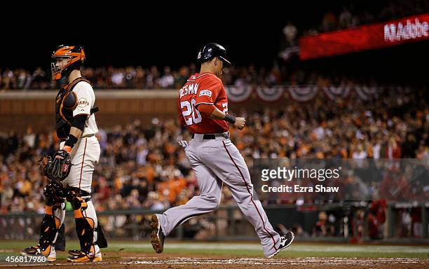 Ian Desmond of the Washington Nationals scores on and RBI double by Bryce Harper in the fifth inning against the San Francisco Giants during Game...