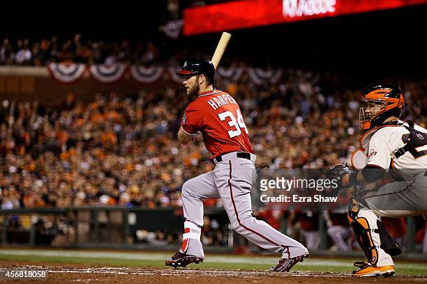 Bryce Harper of the Washington Nationals hits an RBI double scoring Ian Desmond in the fifth inning against the San Francisco Giants during Game Four...