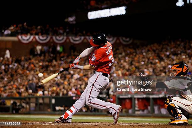 Bryce Harper of the Washington Nationals hits a solo home run in the seventh inning against the San Francisco Giants during Game Four of the National...