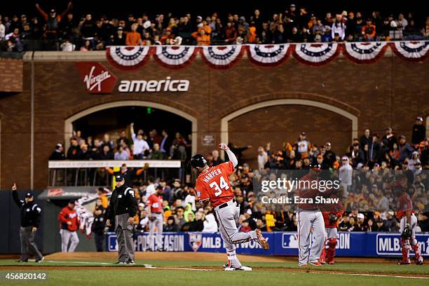 Bryce Harper of the Washington Nationals celebrates as he rounds the bases on his solo home run in the seventh inning against the San Francisco...