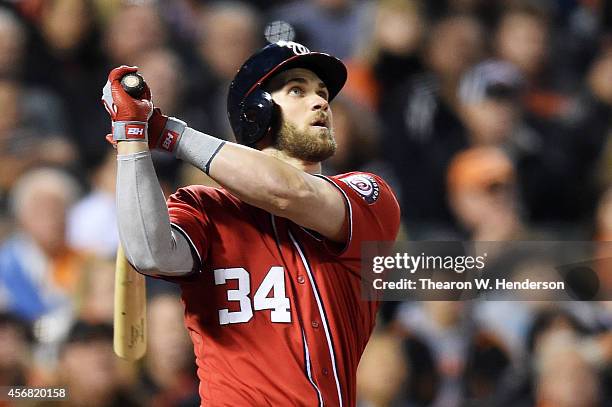 Bryce Harper of the Washington Nationals hits a solo home run in the seventh inning against the San Francisco Giants during Game Four of the National...