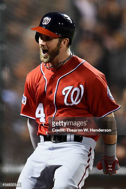 Bryce Harper of the Washington Nationals celebrates his solo home run in the seventh inning against the San Francisco Giants during Game Four of the...