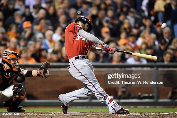 Bryce Harper of the Washington Nationals hits a solo home run in the seventh inning against the San Francisco Giants during Game Four of the National...