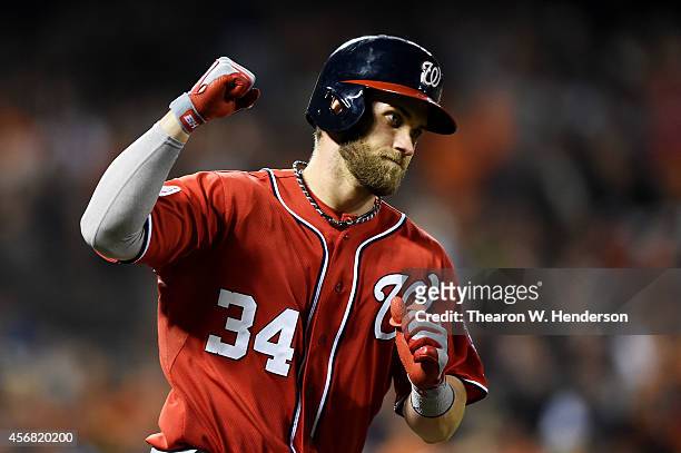 Bryce Harper of the Washington Nationals celebrates as he rounds the bases on his solo home run in the seventh inning against the San Francisco...