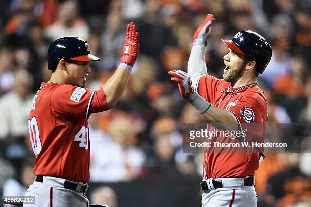 Bryce Harper of the Washington Nationals celebrates his solo home run with Wilson Ramos in the seventh inning against the San Francisco Giants during...