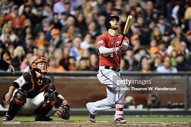 Bryce Harper of the Washington Nationals hits a solo home run in the seventh inning against the San Francisco Giants during Game Four of the National...