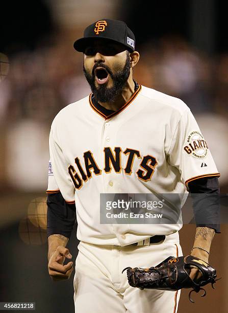 Sergio Romo of the San Francisco Giants celerates after the final out of the eighth inning against the Washington Nationals during Game Four of the...