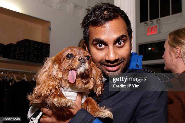 Actor Aziz Ansari and four-legged friend Toast attend the Band of Outsiders and Bon Appetit Magazine celebration of the opening of Milk Bar Soho at...