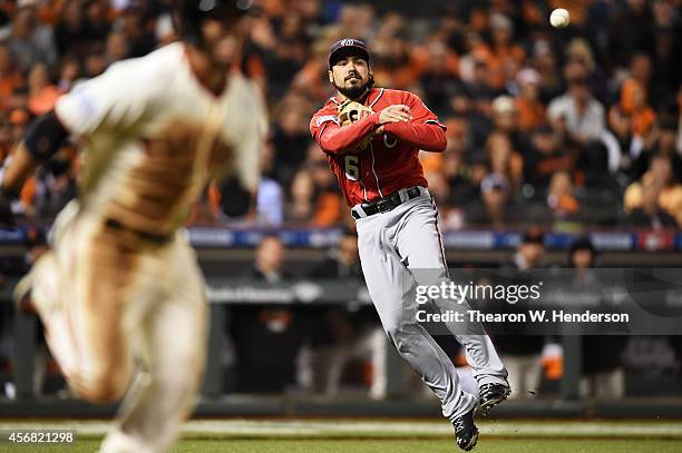 Anthony Rendon of the Washington Nationals throws out Gregor Blanco of the San Francisco Giants in the seventh inning during Game Four of the...