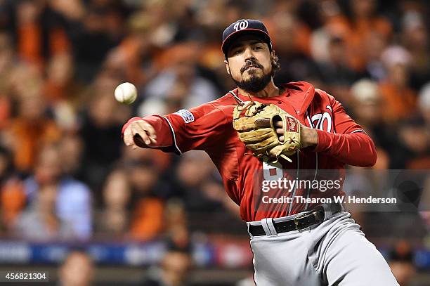 Anthony Rendon of the Washington Nationals throws out Gregor Blanco of the San Francisco Giants in the seventh inning during Game Four of the...
