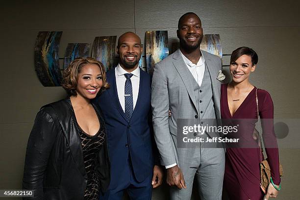 Danielle Daniels Forte, NFL Player Matt Forte, NFL Player Martellus Bennett, and Siggi Bennett attend Michigan Avenue Magazine's October Cover...