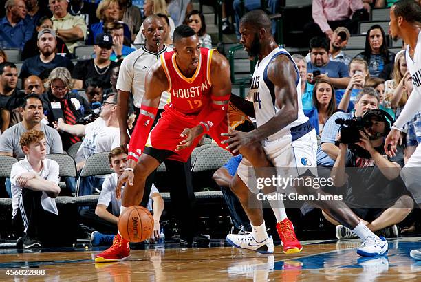 Dwight Howard of the Houston Rockets posts up against Ivan Johnson of the Dallas Mavericks on October 7, 2014 at the American Airlines Center in...