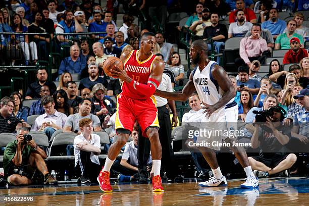 Dwight Howard of the Houston Rockets posts up against Ivan Johnson of the Dallas Mavericks on October 7, 2014 at the American Airlines Center in...