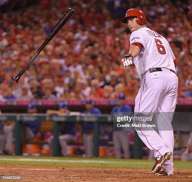 David Freese of the Los Angeles Angels of Anaheim tosses his bat during the game against the Kansas City Royals during Game One of the American...