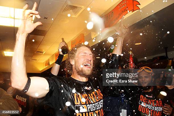 Hunter Pence of the San Francisco Giants celebrates in the locker room after their 3 to 2 win over the Washington Nationals in Game Four of the...