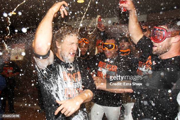 Hunter Pence of the San Francisco Giants celebrates in the locker room after their 3 to 2 win over the Washington Nationals in Game Four of the...