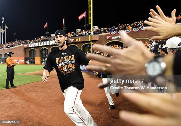 Madison Bumgarner of the San Francisco Giants celebrates their 3 to 2 win over the Washington Nationals during Game Four of the National League...