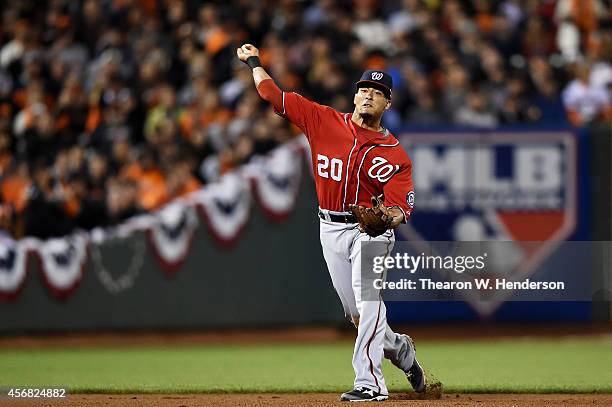 Ian Desmond of the Washington Nationals fields a ball for an out on Matt Duffy of the San Francisco Giants in the sixth inning during Game Four of...