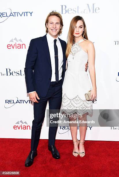Actor Luke Bracey and actress Liana Liberato arrive at the Los Angeles premiere of "The Best Of Me" at the Regal Cinemas L.A. Live on October 7, 2014...