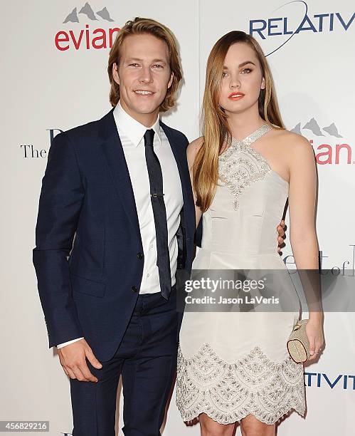 Actor Luke Bracey and actress Liana Liberato attend the premiere of "The Best Of Me" at Regal Cinemas L.A. Live on October 7, 2014 in Los Angeles,...