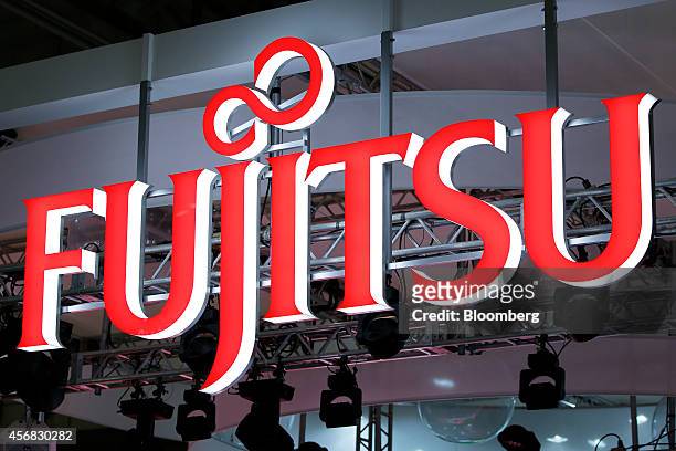 The Fujitsu Ltd. Logo is displayed at the company's booth at the Cutting-Edge IT & Electronics Comprehensive Exhibition in Chiba, Japan, on Tuesday,...