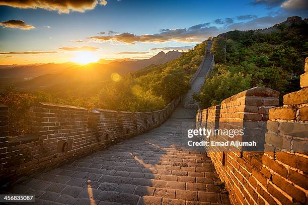 sunset over the great wall of china - great wall of china stock pictures, royalty-free photos & images