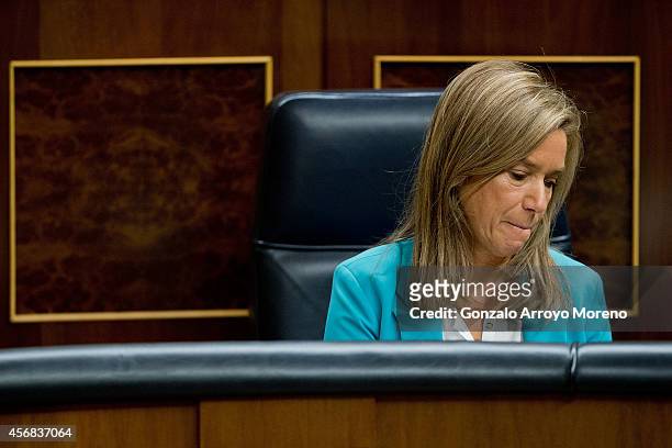 Spanish Health Minister Ana Mato bites her lips during a plenary session at the Spanish Parliament on October 8, 2014 in Madrid, Spain. Spanish...